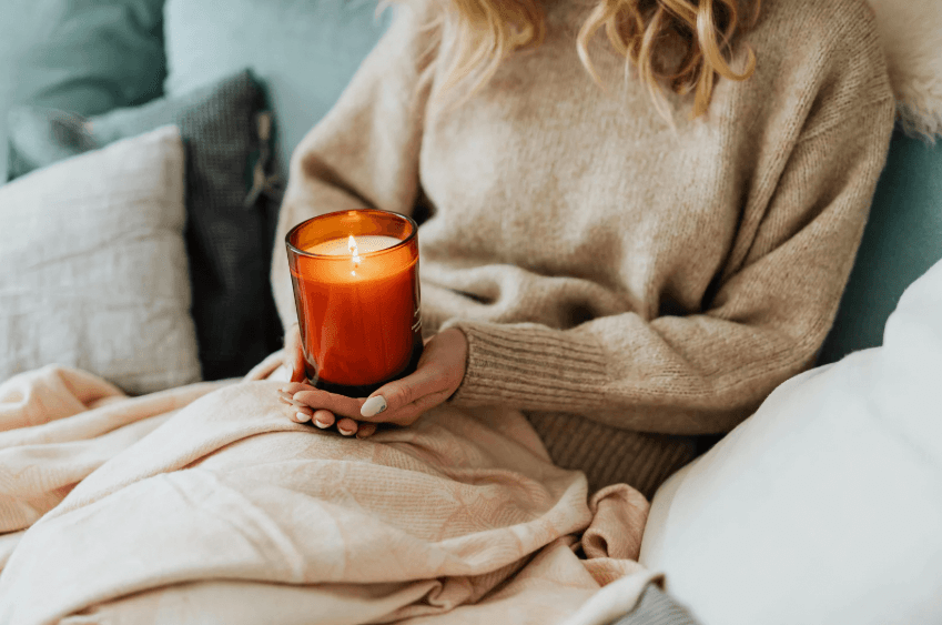 A woman holding a candle.